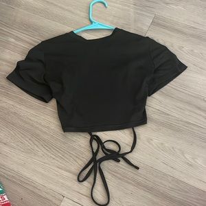 A backless black crop top